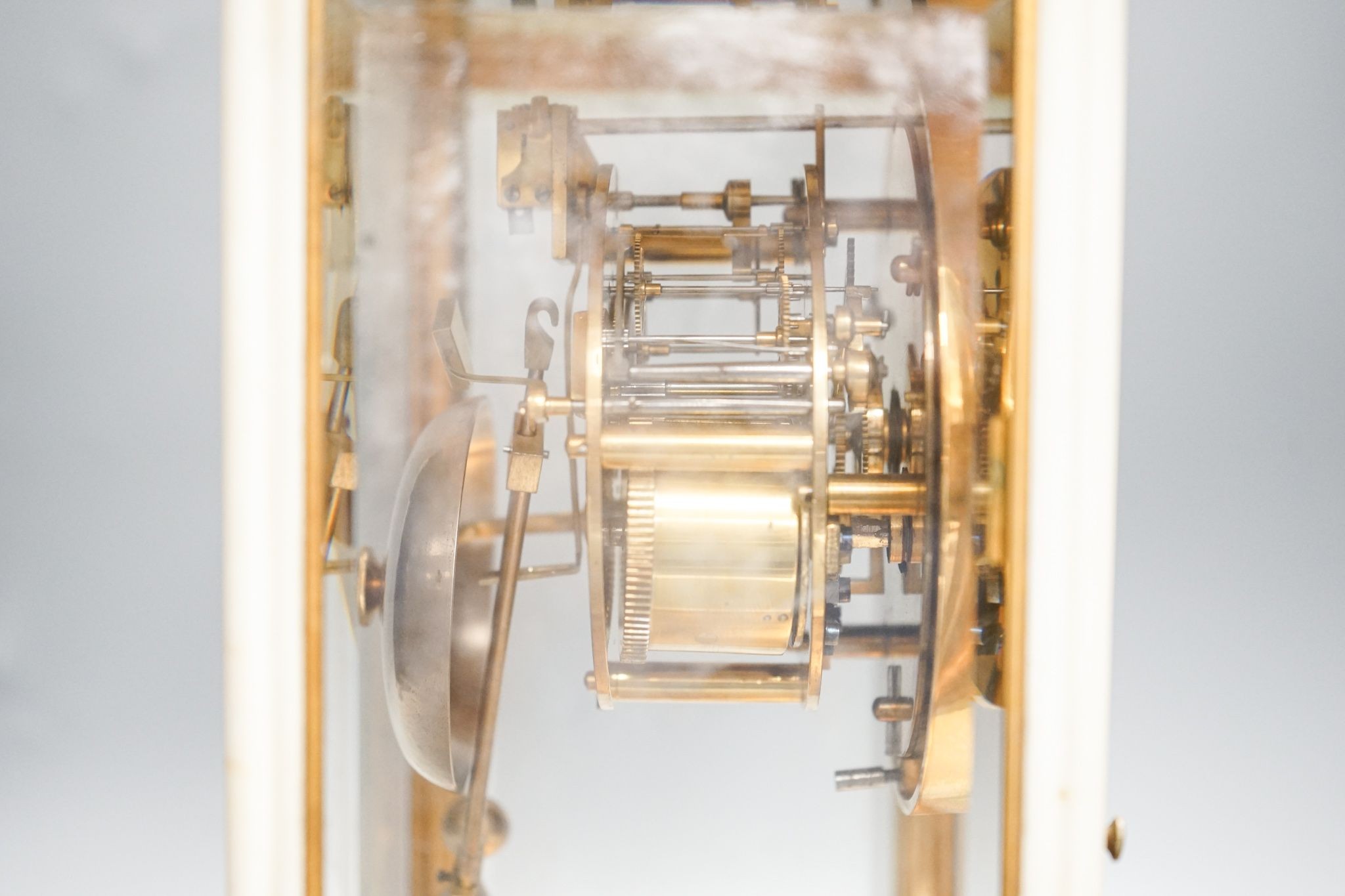 An unusual French white marble and brass cased four glass mantel clock, late 19th century, bi-metallic pendulum, no key. 32cm